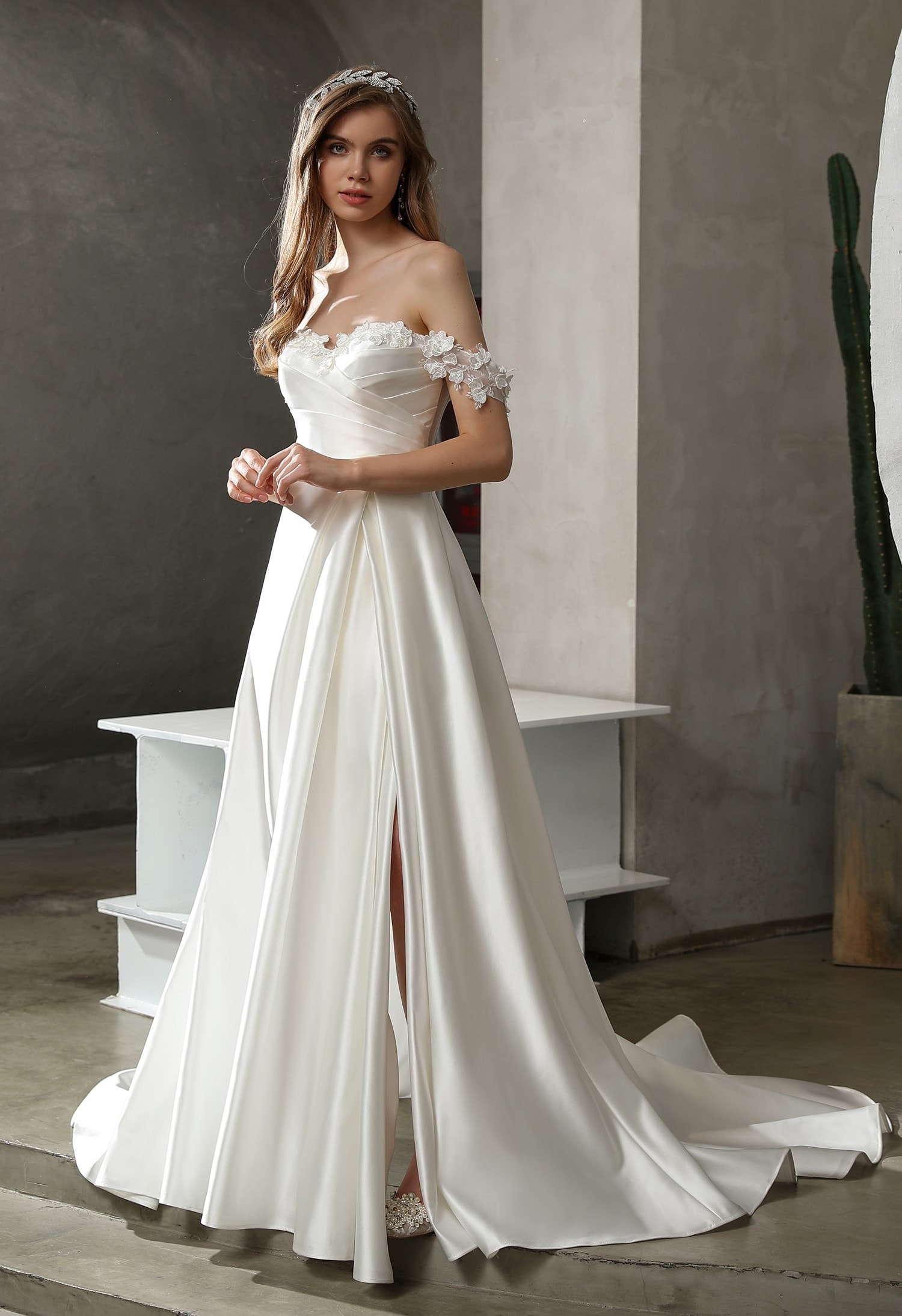 Bride in a deep V-neck minimalist crepe wedding dress