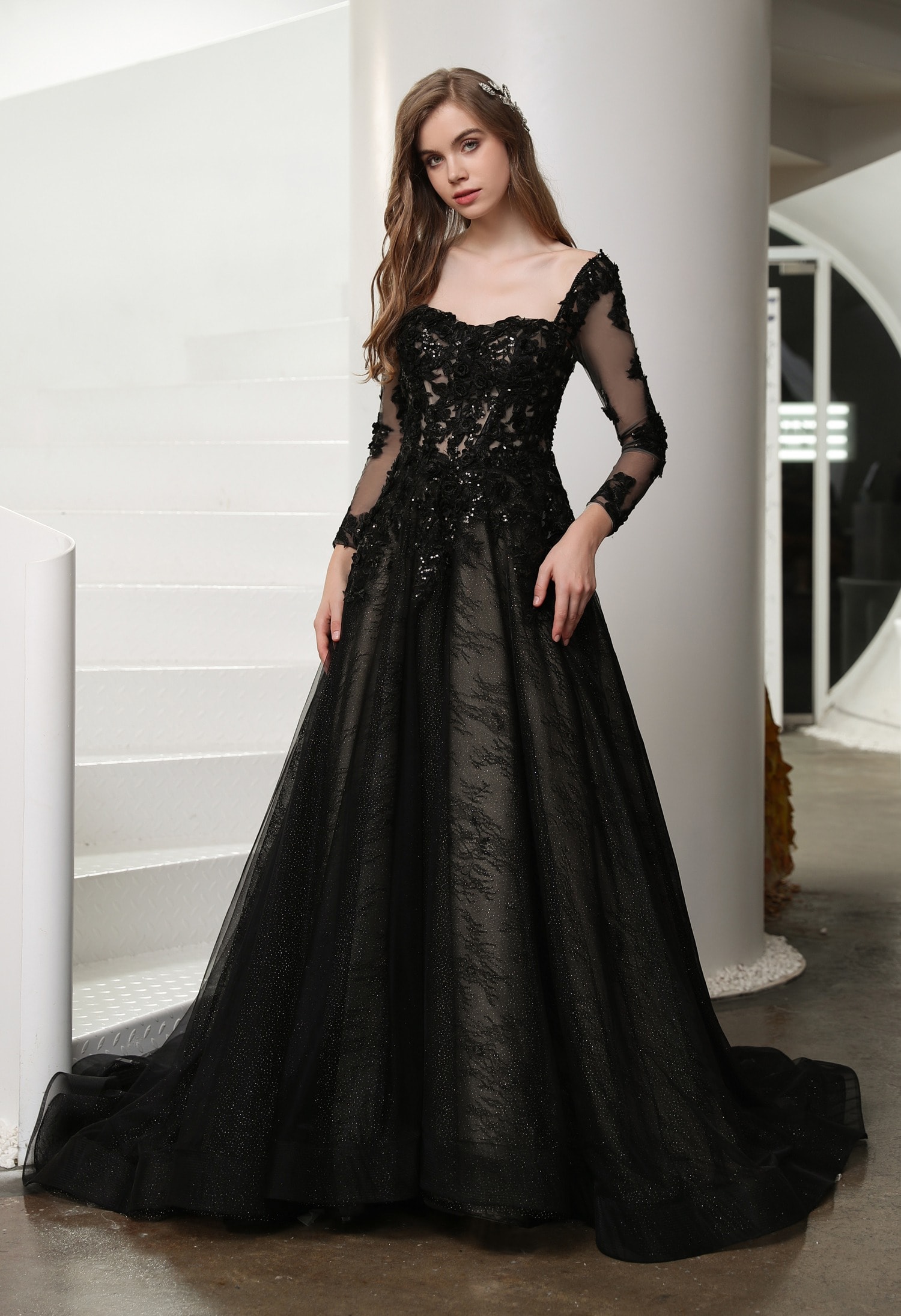 Bride in a romantic chiffon flowy wedding dress in a garden