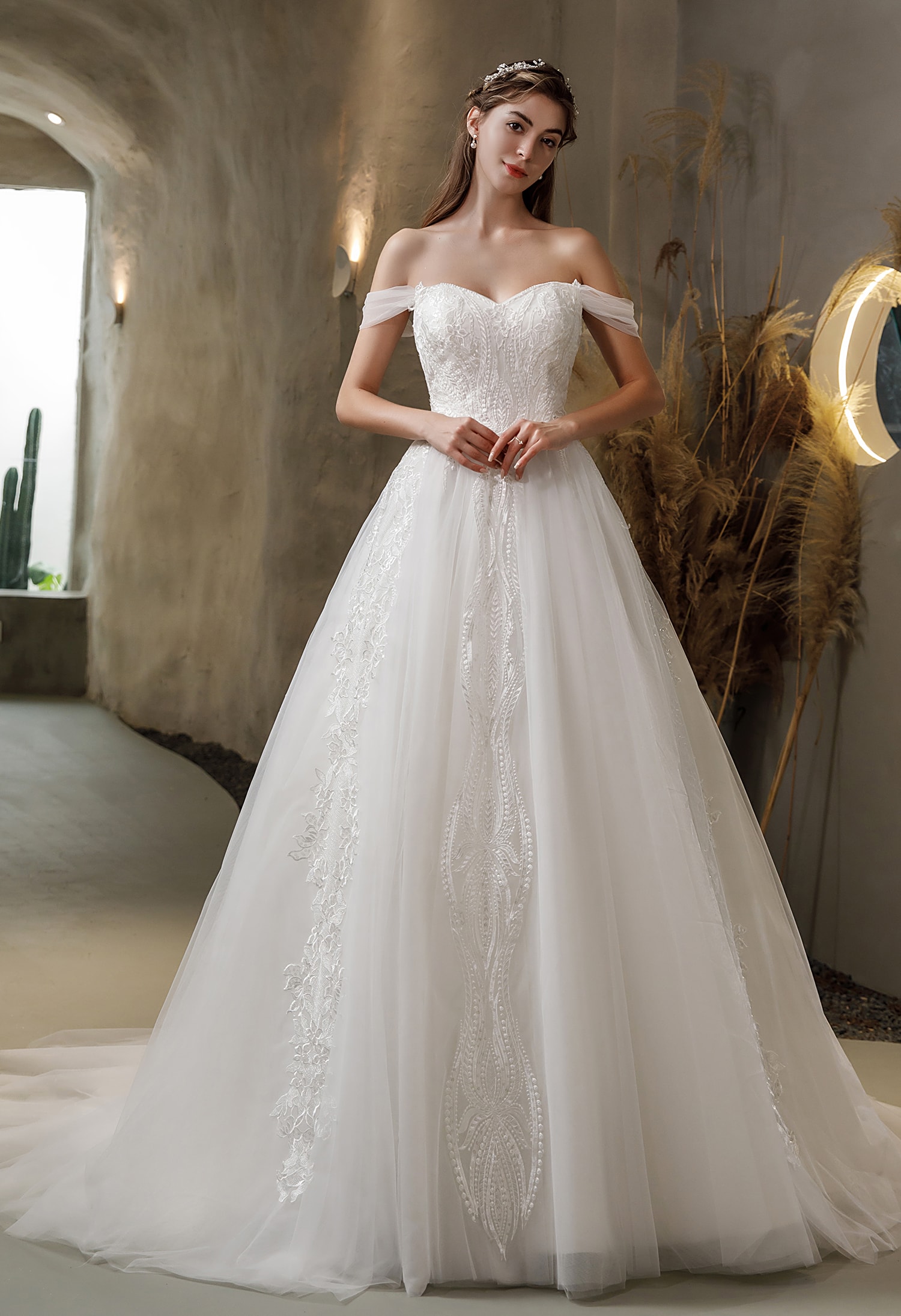 Bride in a ruched bodice elegant wedding gown full length
