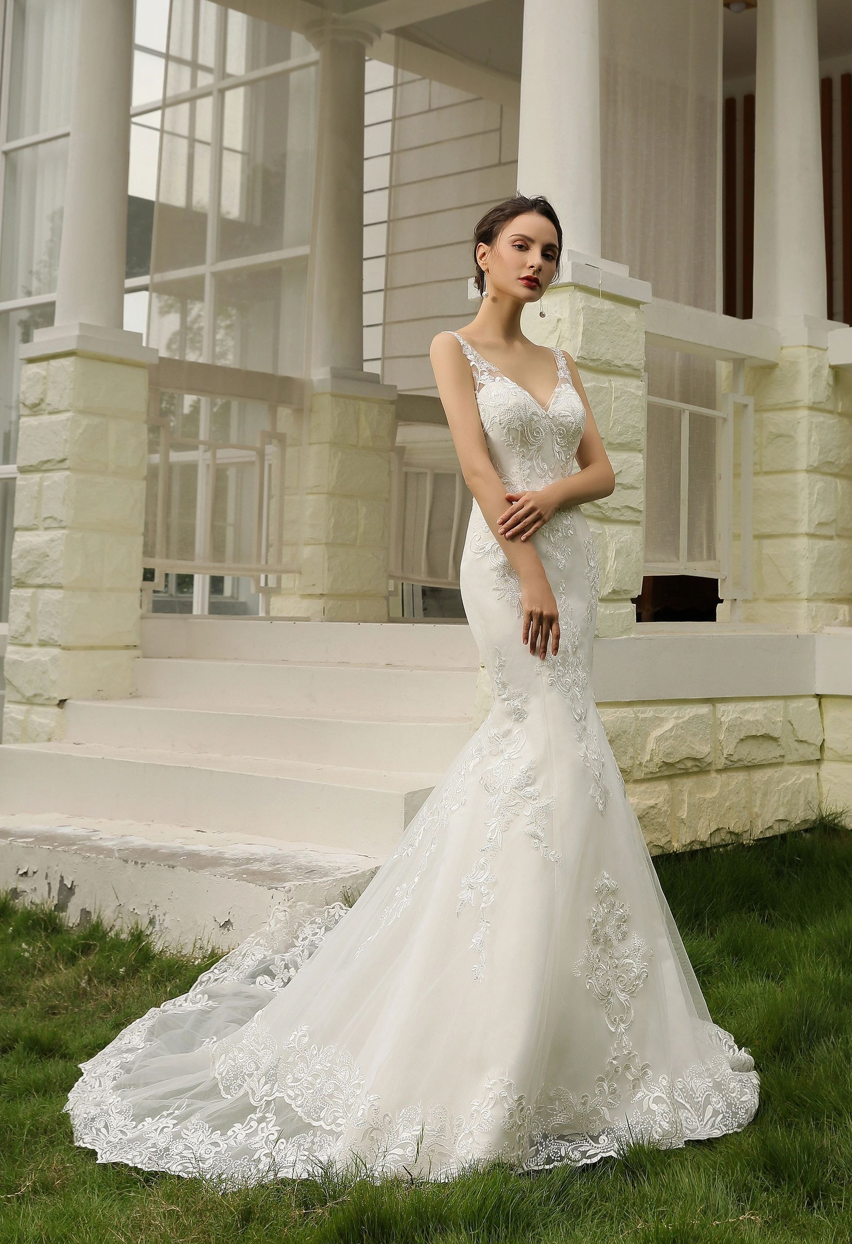 Elegant bride in a white embellished wedding gown